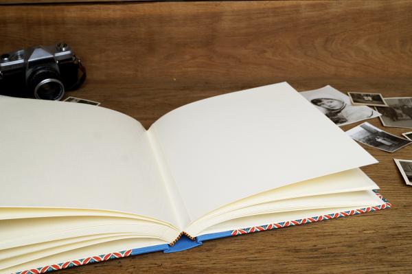 Album for photos to stick in light-colored pages